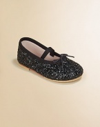 This sparkly, slip-on, ballerina-inspired flat adds a glitz and glam to your little girl's precious feet.Elastic strap with adjustable tieFabric upperFabric liningRubber solePadded insoleImported