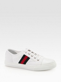 Canvas sneaker with leather trim and signature web detail.Green/red/green signature web detailRubber sole embossed with Gucci script logoMade in Italy Canvas sneaker with leather trim and signature web detail.Green/red/green signature web detailRubber sole embossed with Gucci script logoMade in Italy