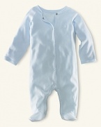 Ralph Lauren Childrenswear solid coverall. An adorable solid long-sleeved footed coverall in soft cotton jersey. Crew neckline, full ring-snap placket, fold-over detail at the cuffs. Ribbed neckline, placket and cuffs. Our signature satin logo patch accents the back neck.