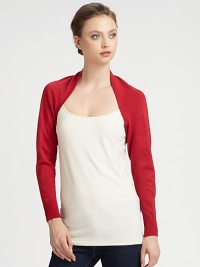 An open-front, long-sleeved knit design in a bold hue.Open frontLong cuffed sleevesAbout 10 from shoulder to hem80% rayon/20% nylonDry cleanImported