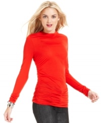 This DKNY Jeans turtleneck comes in a variety of versatile colors and offers a curve-hugging fit, thanks to ruching at the sides. This DKNY Jeans turtleneck comes in a variety of versatile colors and offers a curve-hugging fit, thanks to ruching at the sides.