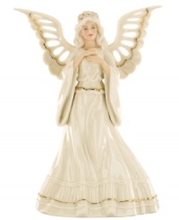 Every tree needs an angel! Top your tree with this glowing angel figurine, draped in pure ivory porcelain and gold trim. Every tree needs an angel! Top your tree with this glowing angel figurine, draped in pure ivory porcelain and gold trim.
