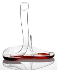 Discover the art of decanting. The twisting, serpentine shape of the Mamba decanter transforms wine as it flows through every bend, enhancing it far more efficiently than a typical bowl-shaped carafe. An extraordinary piece in pure crystal by CEO Maximilian J. Riedel. Discover the art of decanting. The twisting, serpentine shape of the Mamba decanter transforms wine as it flows through every bend, enhancing it far more efficiently than a typical bowl-shaped carafe. An extraordinary piece in pure crystal by CEO Maximilian J. Riedel.