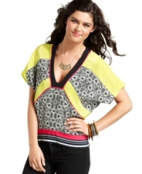 Give your day style a dose of global flavor with a kimono-style top that mixes tribal graphics with bold blocks of color! From Rampage. Give your day style a dose of global flavor with a kimono-style top that mixes tribal graphics with bold blocks of color! From Rampage.