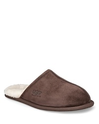 Love your feet with this super-comfy suede slipper with UGG's signature fleece lining. Love your feet with this super-comfy suede slipper with UGG's signature fleece lining.