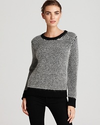 Touchably textured, this DKNY sweater flaunts an oversized stitch for a quirky-cool approach to everyday style. Toughen the soft silhouette with sleek skinnes for downtown edge. Touchably textured, this DKNY sweater flaunts an oversized stitch for a quirky-cool approach to everyday style. Toughen the soft silhouette with sleek skinnes for downtown edge.