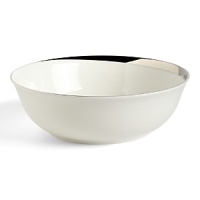 This round vegetable bowl glows with a hand-painted bright platinum design to create a contemporary classic on your table that will complement your dining experience throughout a lifetime of shifting trends and evolving fashions. This round vegetable bowl glows with a hand-painted bright platinum design to create a contemporary classic on your table that will complement your dining experience throughout a lifetime of shifting trends and evolving fashions.