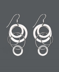 Let chic circles orbit your earlobes. These funky asymmetrical earrings feature interlocking circles set in sterling silver. Approximate drop: 2 inches. Let chic circles orbit your earlobes. These funky asymmetrical earrings feature interlocking circles set in sterling silver. Approximate drop: 2 inches.