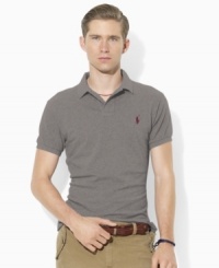 Designed in a trim modern fit with higher armholes, a slimmer cut and a shorter hem, this short-sleeved polo shirt is rendered in breathable cotton mesh for iconic style. Designed in a trim modern fit with higher armholes, a slimmer cut and a shorter hem, this short-sleeved polo shirt is rendered in breathable cotton mesh for iconic style.