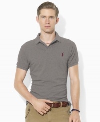 Designed in a trim modern fit with higher armholes, a slimmer cut and a shorter hem, this short-sleeved polo shirt is rendered in breathable cotton mesh for iconic style.