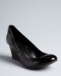 Tory Burch elevates your favorite ballet flats in a sleek wedge design that adds height when it's right. Subtly elegant logos finish off the look. Tory Burch elevates your favorite ballet flats in a sleek wedge design that adds height when it's right. Subtly elegant logos finish off the look.