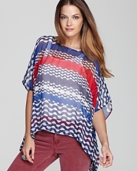 This geometric printed Red Haute caftan is shaping up to be a delightful wardrobe addition. This geometric printed Red Haute caftan is shaping up to be a delightful wardrobe addition.