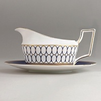 Embellished with intricate garlands, oval links and a fanciful dragon motif, this Wedgwood dinnerware evokes Europe's glorious Renaissance period. Rendered in deep blue and gold to transform any formal meal into a spectacular royal gala. Embellished with intricate garlands, oval links and a fanciful dragon motif, this Wedgwood dinnerware evokes Europe's glorious Renaissance period. Rendered in deep blue and gold to transform any formal meal into a spectacular royal gala.