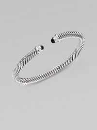 From the Color Classic Collection. A signature Yurman cable of sterling silver, richly enhanced by bands of pavé diamonds, encircling black onyx end caps. Diamonds, 0.09 tcw Black onyx Sterling silver Cable, 5mm Diameter, about 2½ Made in USA From the Color Classic Collection. A signature Yurman cable of sterling silver, richly enhanced by bands of pavé diamonds, encircling black onyx end caps. Diamonds, 0.09 tcw Black onyx Sterling silver Cable, 5mm Diameter, about 2½ Made in USA