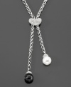 A classic contrast of black and white dangles from this elegant diamond (1/5 ct. t.w.) necklace. With one freshwater pearl (9-9.5mm) and one onyx stone (9-9.5mm). 18 sterling silver chain.