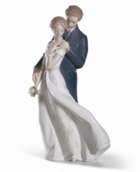 Celebrate your eternal love with this charming porcelain figurine from Lladro. The intricate detail and endearing sentiment make this piece a lovely gift for any special couple. Celebrate your eternal love with this charming porcelain figurine from Lladro. The intricate detail and endearing sentiment make this piece a lovely gift for any special couple.