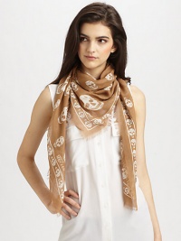 An allover skull print on a striking scarf in a blend of luxurious fibers. 90% modal/10% cashmereAbout 47 X 41Dry cleanMade in Italy An allover skull print on a striking scarf in a blend of luxurious fibers. 90% modal/10% cashmereAbout 47 X 41Dry cleanMade in Italy