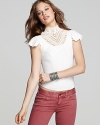 This Free People top touts a Victorian-inspired lace neckline for a dose of romance.