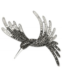 Take something stylish under your wing. Judith Jack's bird brooch is crafted from sterling silver with marcasite (4/5 ct. t.w.) and crystal (1/2 ct. t.w.) giving it an elegant touch. Approximate drop: 2-1/2 inches. Take something stylish under your wing. Judith Jack's bird brooch is crafted from sterling silver with marcasite (4/5 ct. t.w.) and crystal (1/2 ct. t.w.) giving it an elegant touch. Approximate drop: 2-1/2 inches.