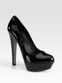 Low-cut patent leather style with a sky-high heel and a platform. Self-covered heel, 6 (150mm)Covered platform, 1 (25mm)Compares to 5 heel (125mm)Patent leather upperLeather lining and solePadded insoleMade in ItalyOUR FIT MODEL RECOMMENDS ordering one size up as this style runs small. 