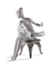 This young ballerina has graceful poise, even while primping for her moment on stage. With lustrous silver leaf accents and an intricate lace trimmed tutu, this hand-painted figurine is a beautiful gift for any aspiring dancer. 6 x 4.75. This young ballerina has graceful poise, even while primping for her moment on stage. With lustrous silver leaf accents and an intricate lace trimmed tutu, this hand-painted figurine is a beautiful gift for any aspiring dancer. 6 x 4.75.