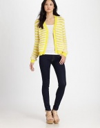 Tastefully textured-- this striped, hand-knit v-neck has a button front, ribbed trim and slash pockets. V-neckButton frontLong sleevesRibbed cuffs and hemSlash pockets98% cotton/2% nylonDry cleanImportedModel shown is 5'9 (175cm) wearing US size Small.
