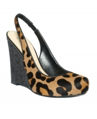 Bust out your party dress with the Russole slingback wedges by GUESS. The on-trend leopard print and sky-high wedges are smoking hot. Bust out your party dress with the Russole slingback wedges by GUESS. The on-trend leopard print and sky-high wedges are smoking hot.