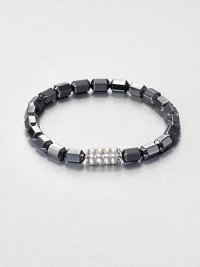 The Bedeg collection celebrates the simple, yet exquisite Indonesian artisanship found in woven bamboo with a modern design interpretation captured in traditional techniques. This beaded style is designed in sterling silver with hematite.Sterling silverHematitePusher claspDiameter, about 6Imported