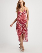 This voluminous, semi-sheer style features a bright ikat print and an asymmetrical hem. ScoopneckSleevelessRacerbackContrast pipingAsymmetrical hemAbout 50 from shoulder to hemPolyesterHand washMade in USA of imported fabrics