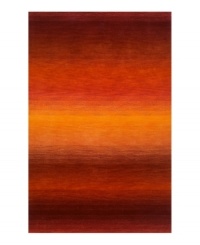 Imparting warm visions of brilliant sunrises on the horizon, this deeply textured rug features intense tones of red and orange that recall a perfect morning sky. Hand-tufted and color blended with the greatest of care, this wool rug comes alive with texture and color. Imparting warm visions of brilliant sunrises on the horizon, this deeply textured rug features intense tones of red and orange that recall a perfect morning sky. Hand-tufted and color blended with the greatest of care, this wool rug comes alive with texture and color.