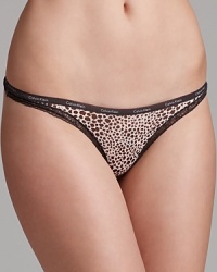 Calvin Klein Underwear's printed thong features intricate lace trim and a logo-stamped waistband. Calvin Klein Underwear's printed thong features intricate lace trim and a logo-stamped waistband.