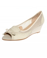 The perfect balance of feminine and masculine. The Swinton peep-toe wedges by Circa by Joan and David are slime and oxford-inspired with revealing mesh sides and a dainty bow at the toe. The perfect balance of feminine and masculine. The Swinton peep-toe wedges by Circa by Joan and David are slime and oxford-inspired with revealing mesh sides and a dainty bow at the toe.