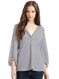 THE LOOKStriped designRound split neckline Long bishop sleevesBack yoke with gathered detailTHE FITAbout 28 from shoulder to hemTHE MATERIAL95% rayon/5% spandexCARE & ORIGINHand washMade in USA of imported fabricModel shown is 5'9½ (176cm) wearing US size Small. THE LOOKStriped designRound split neckline Long bishop sleevesBack yoke with gathered detailTHE FITAbout 28 from shoulder to hemTHE MATERIAL95% rayon/5% spandexCARE & ORIGINHand washMade in USA of imported fabricModel shown is 5'9½ (176cm) wearing US size Small.