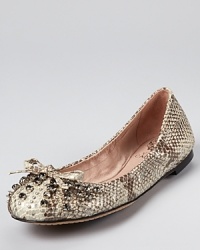 Sparkling rhinestones and serious studs make a statement-making combination on a classic pair of VINCE CAMUTO flats. Sparkling rhinestones and serious studs make a statement-making combination on a classic pair of VINCE CAMUTO flats.