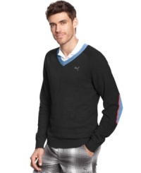 Pops of color on this v-neck Puma golf sweater will be almost as eye-catching as your swing. Pops of color on this v-neck Puma golf sweater will be almost as eye-catching as your swing.