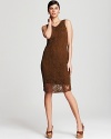 A crochet overlay lends exotic interest to this Jones New York Collection dress, while a natural palette infuses the style with tribal edge. Leather wedges make for a safari-chic finish.