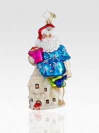 Everyone needs a break! A Hawaiian shirt-clad Santa makes a pit stop at the beach to make some impressive sandcastles. Hand-blownHand-painted5½ tallMade in Poland Everyone needs a break! A Hawaiian shirt-clad Santa makes a pit stop at the beach to make some impressive sandcastles. Hand-blownHand-painted5½ tallMade in Poland