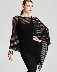 An irreverent cut and allover mesh lend a provocative finish to this Eileen Fisher poncho. Layer the style over sleek, black separates for the ultimate in urban edge. An irreverent cut and allover mesh lend a provocative finish to this Eileen Fisher poncho. Layer the style over sleek, black separates for the ultimate in urban edge.