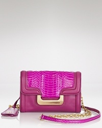 Surrender to the serpentine trend with this exotically inspired crossbody from DIANE von FURSTENBERG, crafted of leather and accented by a subtle flash of skin. Surrender to the serpentine trend with this exotically inspired crossbody from DIANE von FURSTENBERG, crafted of leather and accented by a subtle flash of skin.
