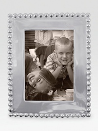 Highly polished and richly dimensional, this elegant frame is hand-crafted of recycled aluminum.Recycled aluminumWipe cleanImported Highly polished and richly dimensional, this elegant frame is hand-crafted of recycled aluminum.Recycled aluminumWipe cleanImported