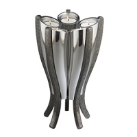 With its curved design and sleek metallic finish, this centerpiece makes a modern design statement that won't go unnoticed. For extra versatility, it holds five candles or tea lights. With its curved design and sleek metallic finish, this centerpiece makes a modern design statement that won't go unnoticed. For extra versatility, it holds five candles or tea lights.