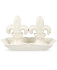 Shaped like the iconic lilies, decorated Fleur de Lys salt and pepper shakers from Portmeirion set tables in the French tradition. Featuring ivory stoneware in a scalloped dish for an extra dash of elegance every day. Shaped like the iconic lilies, decorated Fleur de Lys salt and pepper shakers from Portmeirion set tables in the French tradition. Featuring ivory stoneware in a scalloped dish for an extra dash of elegance every day.