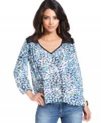 Sheer mesh insets and a colorful, ameba-like print band together seamlessly on this floaty day top from GUESS?. Sheer mesh insets and a colorful, ameba-like print band together seamlessly on this floaty day top from GUESS?.