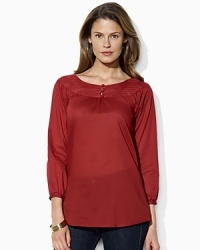 Rendered in light-as-air cotton voile, a feminine top draws inspiration from vintage peasant blouses with an embellished boat neckline and chic knotted buttons. Rendered in light-as-air cotton voile, a feminine top draws inspiration from vintage peasant blouses with an embellished boat neckline and chic knotted buttons.