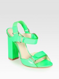 Eye-catching patent leather upper with Velcro® straps and a chunky heel. Self-covered heel, 4 (100mm)Patent leather and elastic upperLeather lining and solePadded insoleMade in Italy Eye-catching patent leather upper with Velcro® straps and a chunky heel. Self-covered heel, 4 (100mm)Patent leather and elastic upperLeather lining and solePadded insoleMade in Italy