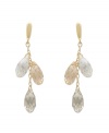 Up your elegance factor in Swarovski's stunning Lagoon earrings. Each pair sparkles elegantly in gold tone mixed metal with Crystal Golden Shadow and clear crystal faceted teardrops.  Approximate drop: 2 inches.
