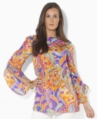 A sweeping paisley pattern and flowing silhouette combine to create this bold tunic, rendered in luxe silk from Lauren by Ralph Lauren. A sweeping paisley pattern and flowing silhouette combine to create this bold tunic, rendered in luxe silk from Lauren by Ralph Lauren.
