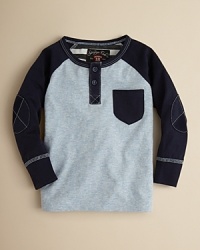 Striking contrast stitching and raglan sleeves set this updated henley apart from the rank-and-file. Striking contrast stitching and raglan sleeves set this updated henley apart from the rank-and-file.