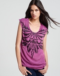 Get urban-glam in a pinch with this sequin-embellished GUESS top. Throw on with skinny black jeans and lace-up wedge booties to hit your next rock concert in style. Get urban-glam in a pinch with this sequin-embellished GUESS top. Throw on with skinny black jeans and lace-up wedge booties to hit your next rock concert in style.
