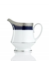 Formal white fine china displays a dramatic combination of scrolling leaves on shimmering platinum and an inner band of intense cobalt blue. Dishwasher safe. Formal white fine china displays a dramatic combination of scrolling leaves on shimmering platinum and an inner band of intense cobalt blue. Dishwasher safe.